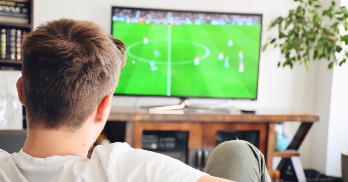 Man watching football on tv